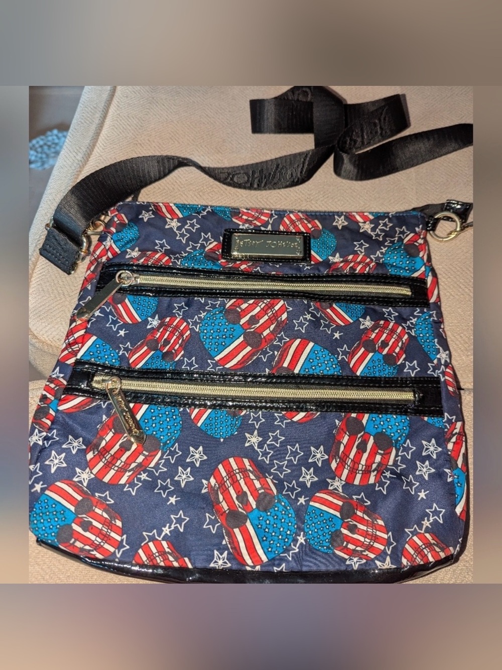 Betsey Johnson crossbody bag navy blue, red, and white star-spangled skull print